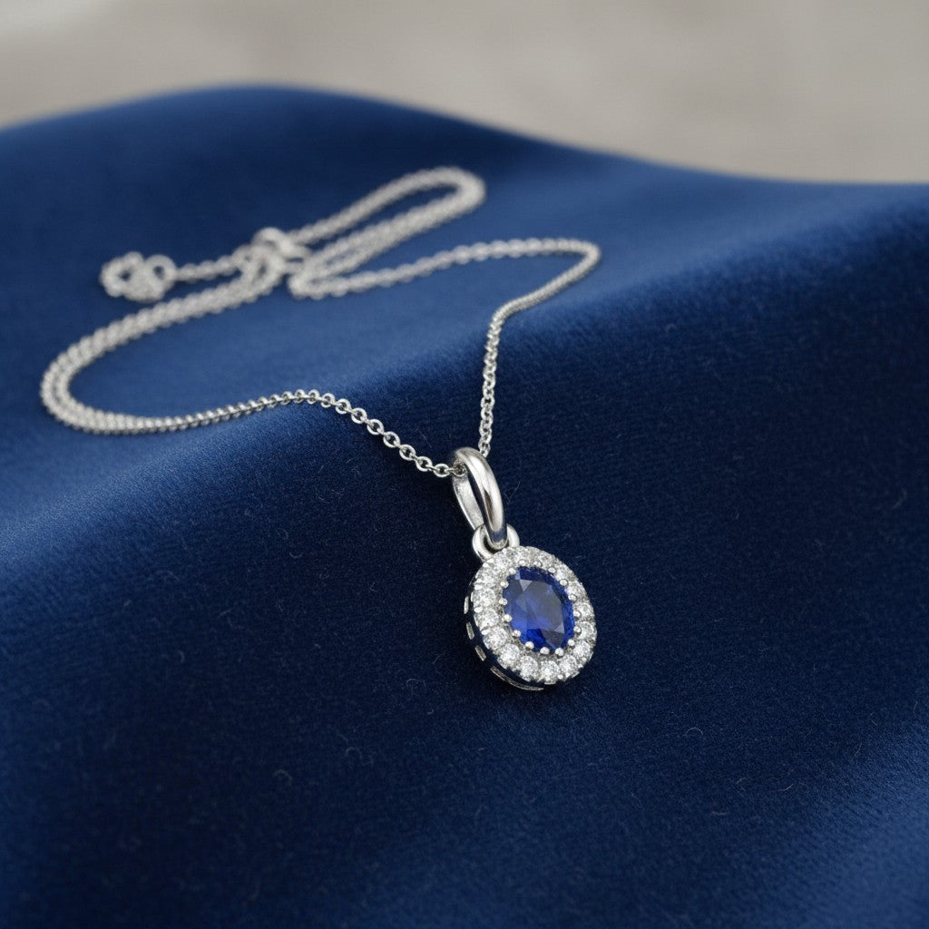Sophia Schneider Joyas 14K white gold oval sapphire halo diamond pendant necklace.