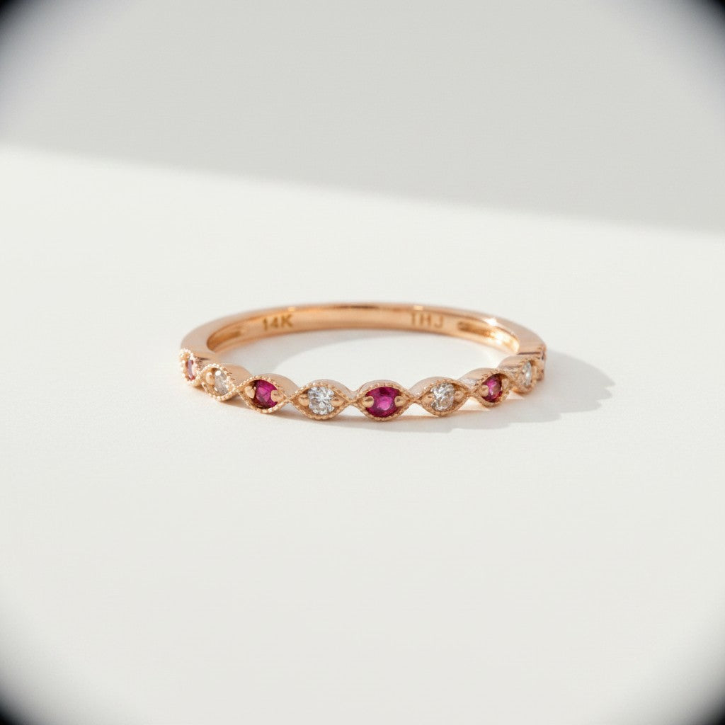 Sophia Schneider Joyas 14K rose gold ring with alternating rubies and 0.09 ct diamonds in a delicate band.