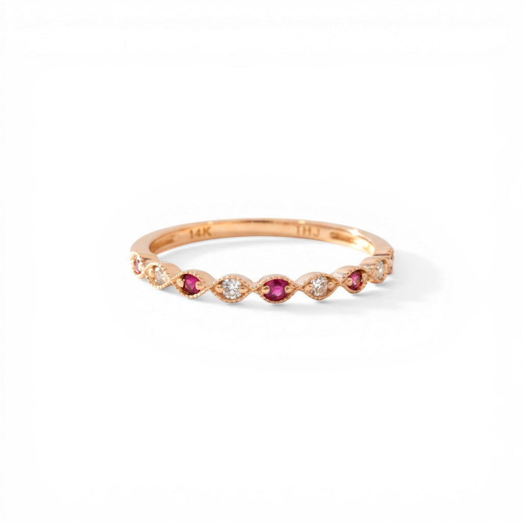 Sophia Schneider Joyas 14K rose gold ring with alternating rubies and 0.09 ct diamonds in a delicate band.