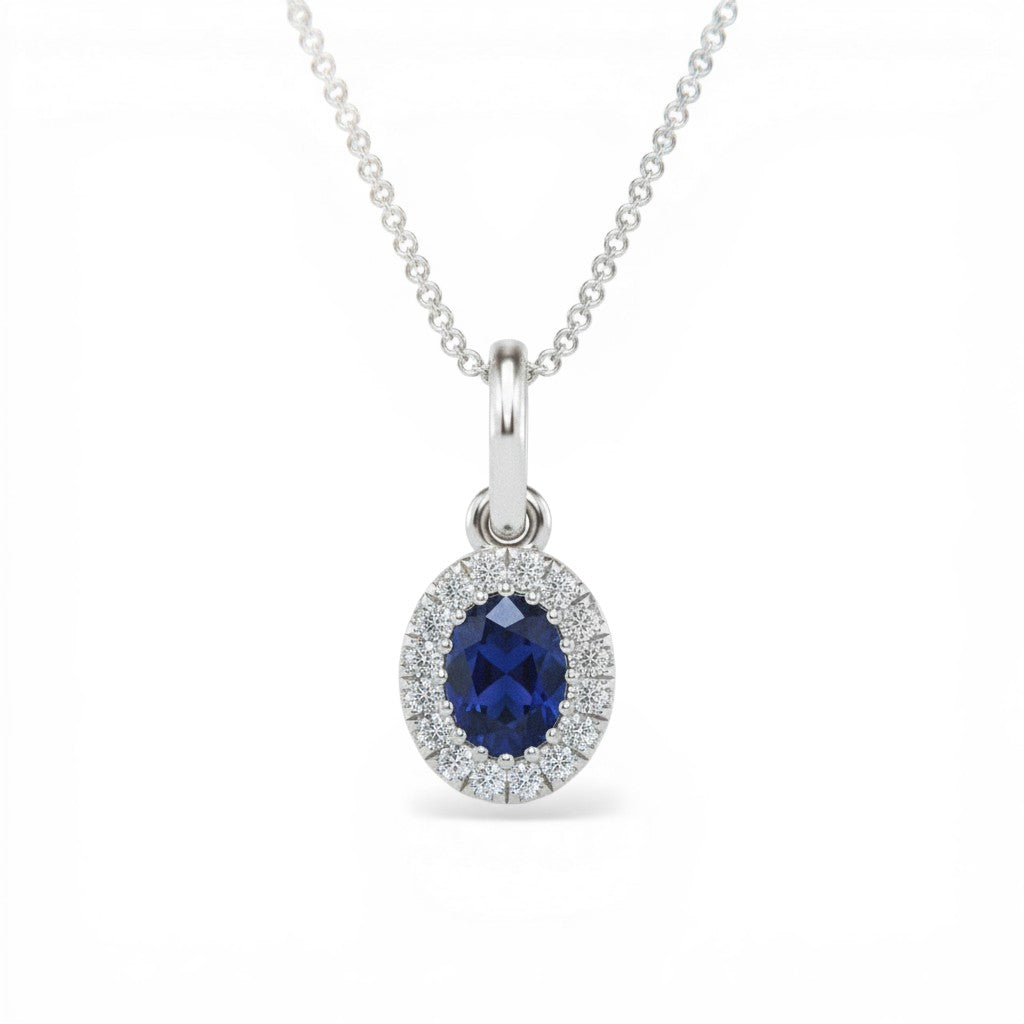 Sophia Schneider Joyas 14K white gold oval sapphire halo diamond pendant necklace.