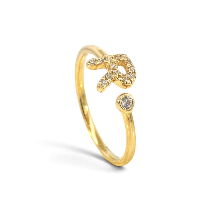 Anillo abierto Sophia Schneider Joyas de oro 18K con letra R decorada con brillantes y un diamante en bisel