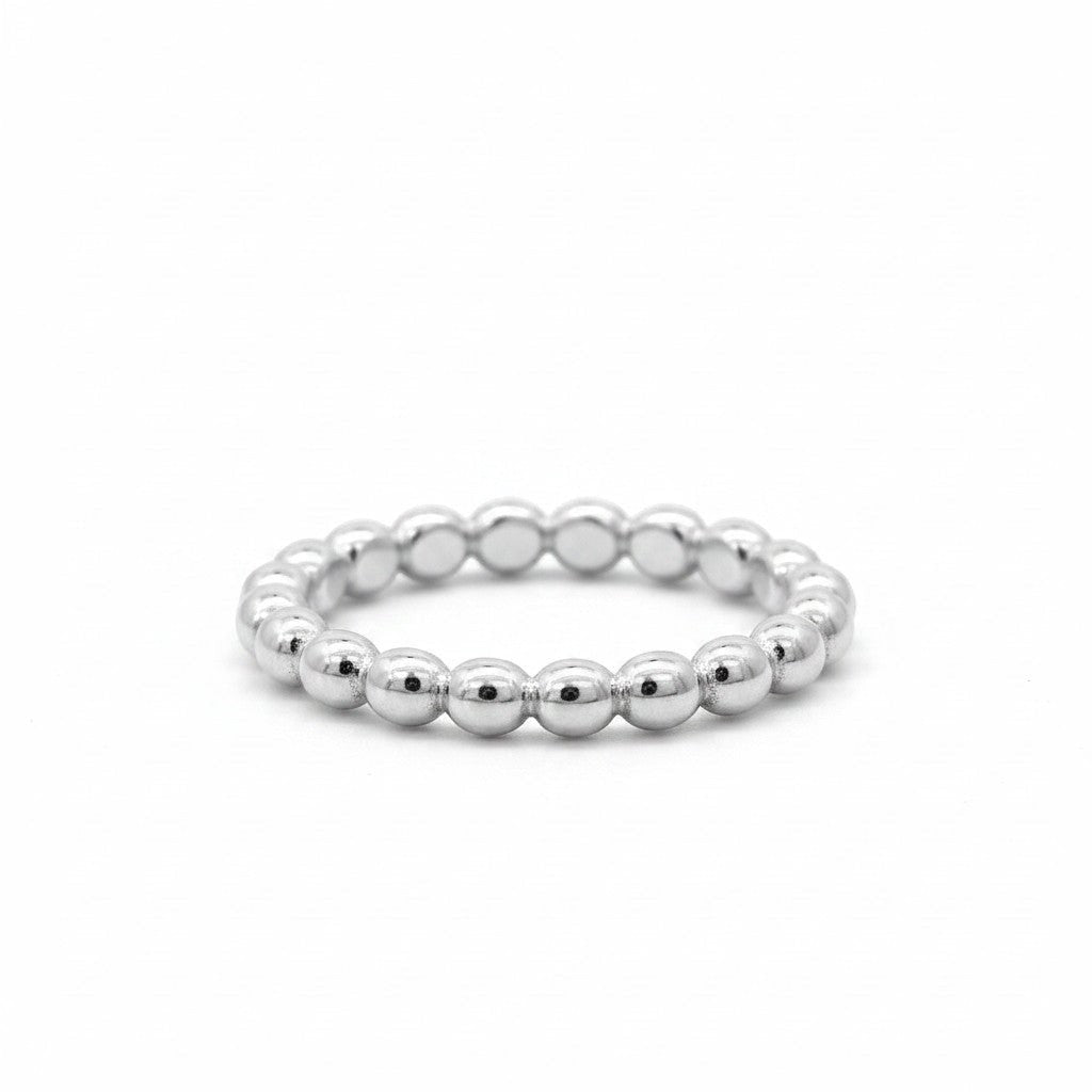 Anillo argolla de plata 925 con diseño de bolitas planas, de Sophia Schneider Joyas.