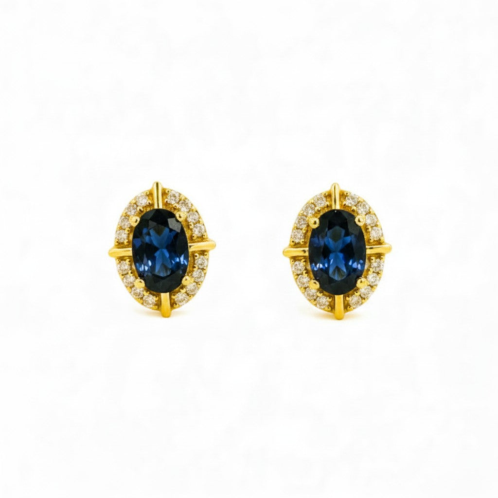 Aros stud Sophia Schneider Joyas de oro 10K con zafiro ovalado central y halo de brillantes