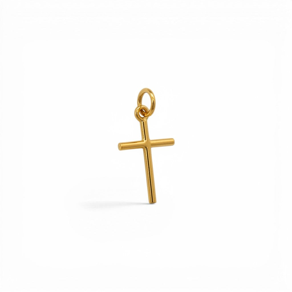 Colgante de cruz minimalista en oro de 18K de Sophia Schneider Joyas, diseño fino y elegante de 11x16 mm.