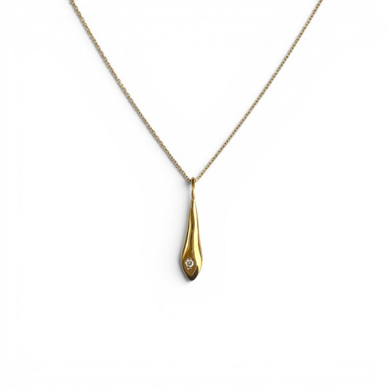 Sophia Schneider Joyas gold teardrop pendant necklace with a small diamond accent on a delicate chain.