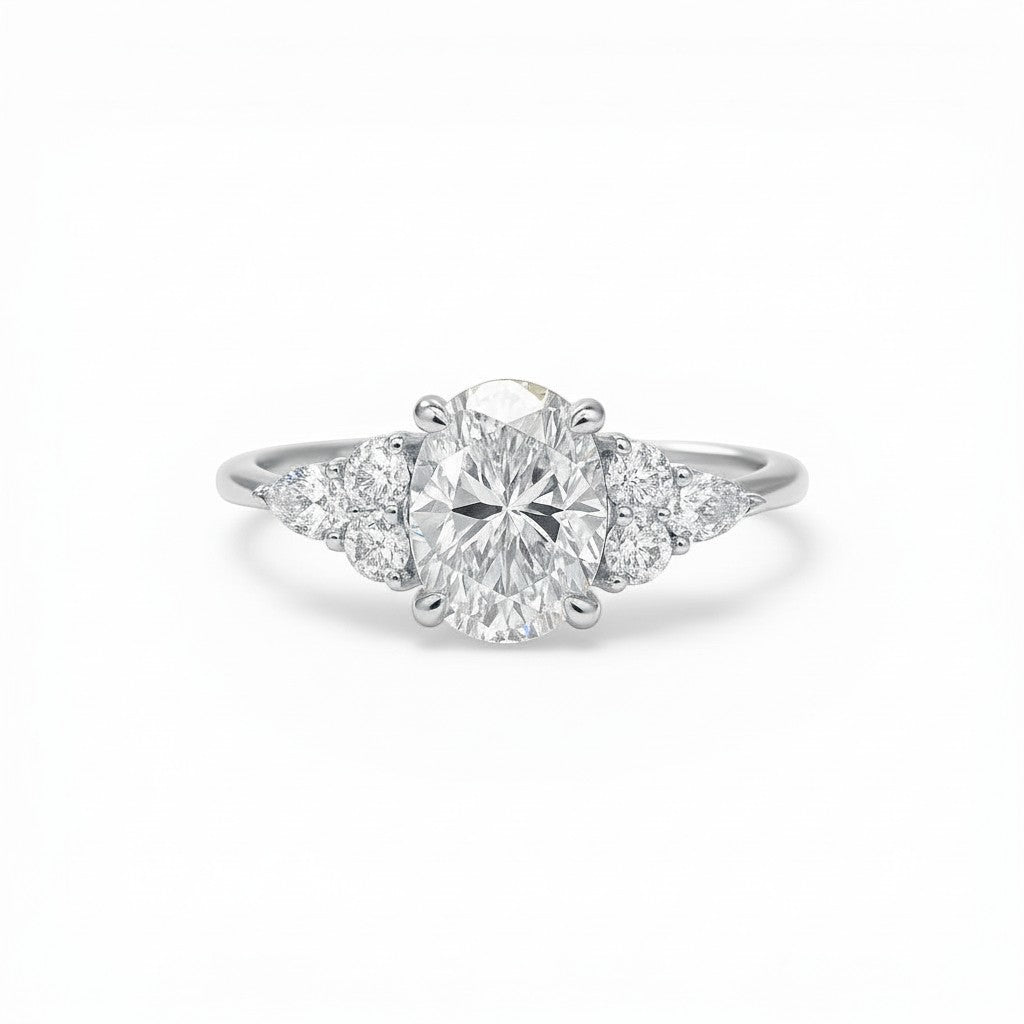 Sophia Schneider Joyas 18K yellow gold ring with oval lab-created diamond and marquise accent stones.