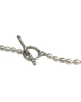 Sophia Schneider Joyas Maris pearl and silver necklace with lapis lazuli accent and toggle clasp.