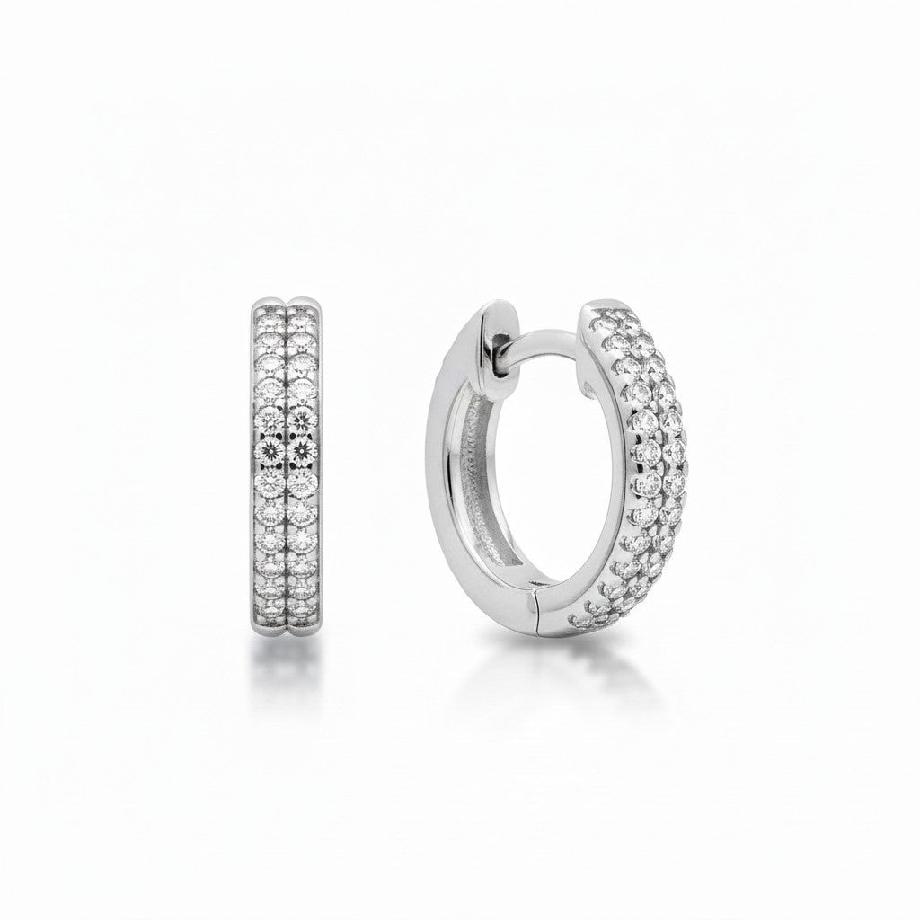 Sophia Schneider Joyas silver hoop earrings with two rows of black pavé diamonds.