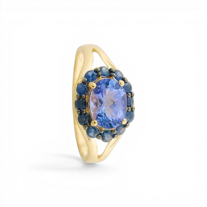 Sophia Schneider Joyas oval tanzanite ring with sapphire halo in silver. 1.82 ct tanzanite, 2.06 ctw sapphires.