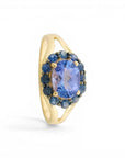 Sophia Schneider Joyas oval tanzanite ring with sapphire halo in silver. 1.82 ct tanzanite, 2.06 ctw sapphires.