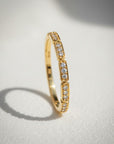 Sophia Schneider Joyas 10K yellow gold band ring with bezel-set diamonds totaling 0.125 ct.