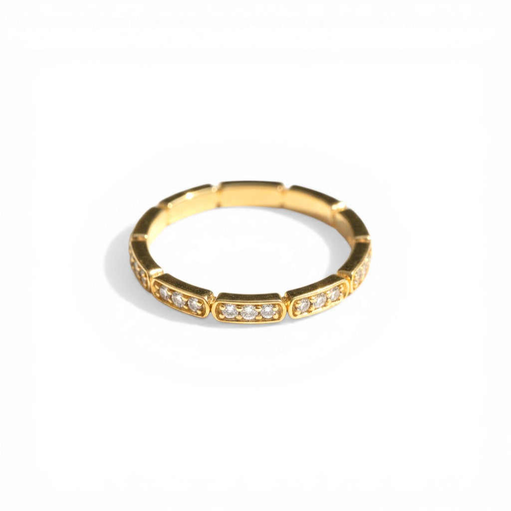 Sophia Schneider Joyas 10K yellow gold band ring with bezel-set diamonds, 0.125 ct total weight.