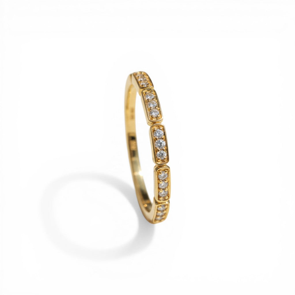 Sophia Schneider Joyas 10K yellow gold band ring with bezel-set diamonds, 0.125 ct total weight.