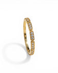 Sophia Schneider Joyas 10K yellow gold band ring with bezel-set diamonds, 0.125 ct total weight.
