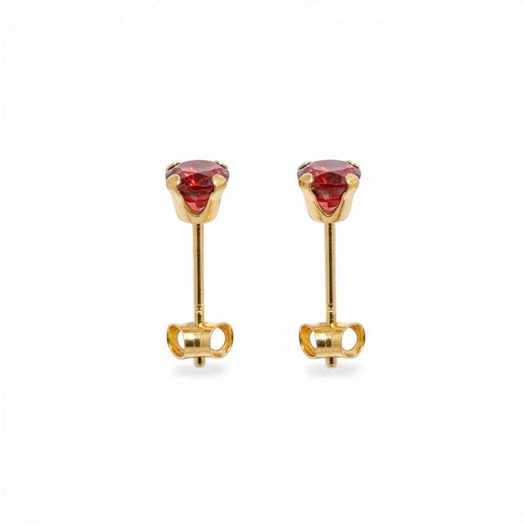 Sophia Schneider Joyas 10K gold stud earrings with 4mm red garnet gemstones set in a prong setting.