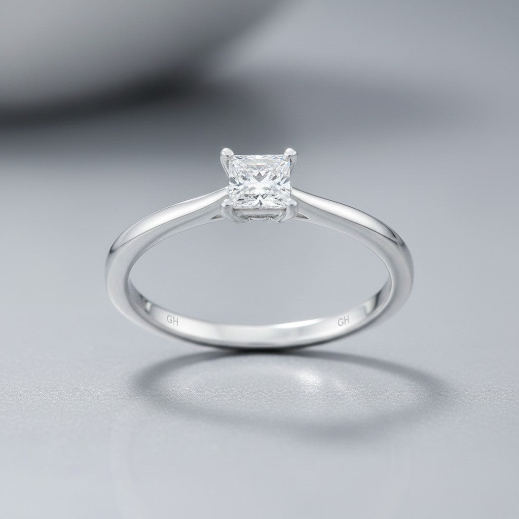 Sophia Schneider Joyas 10K white gold ring with a 0.16 ct princess-cut diamond solitaire.