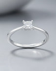Sophia Schneider Joyas 10K white gold ring with a 0.16 ct princess-cut diamond solitaire.