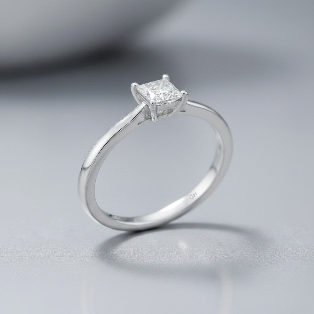 Sophia Schneider Joyas 10K white gold ring with a 0.16 ct princess-cut diamond solitaire.
