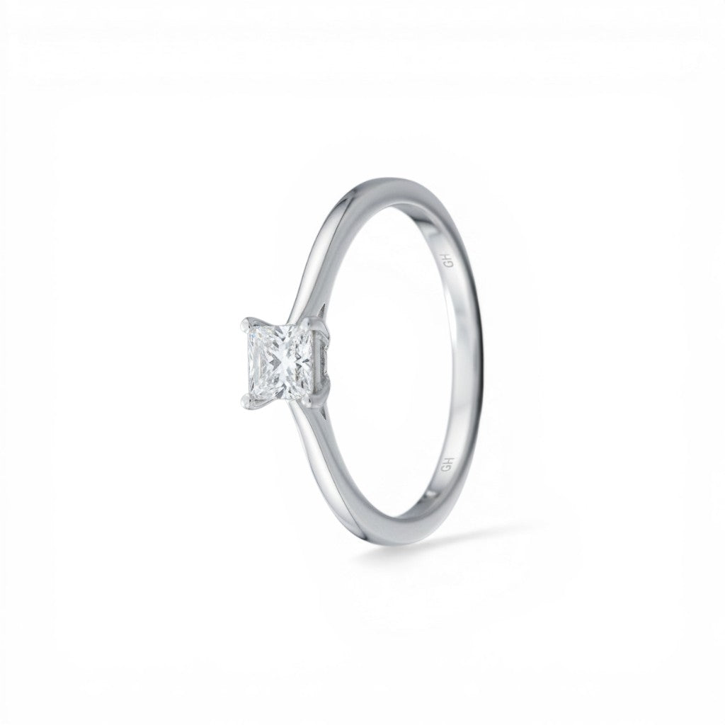 Sophia Schneider Joyas 10K white gold ring with a 0.16 ct princess-cut diamond solitaire.