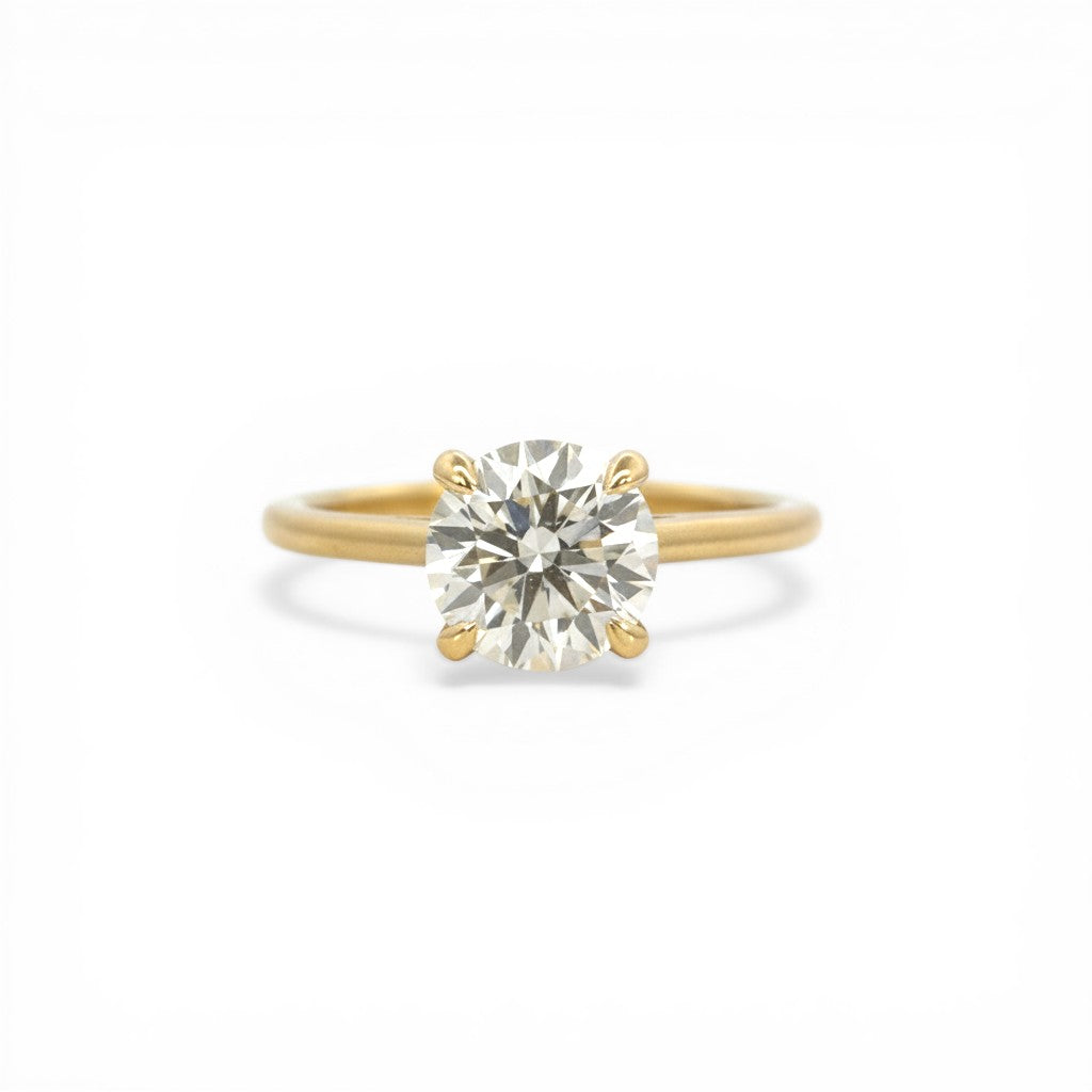 Sophia Schneider Joyas 10K yellow gold solitaire ring with a 2 Ct lab-created diamond.