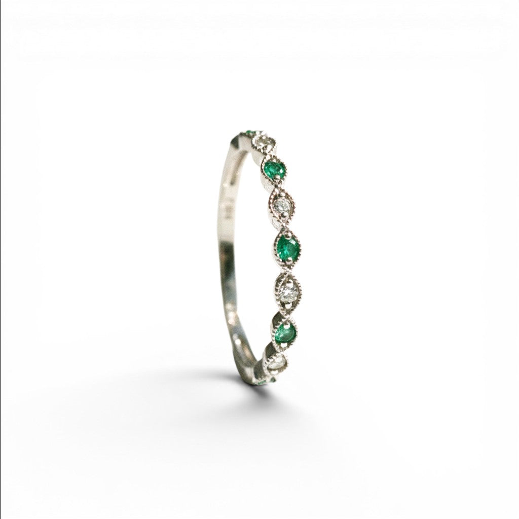 Sophia Schneider Joyas 14K white gold ring with alternating emeralds and diamonds, delicate band.