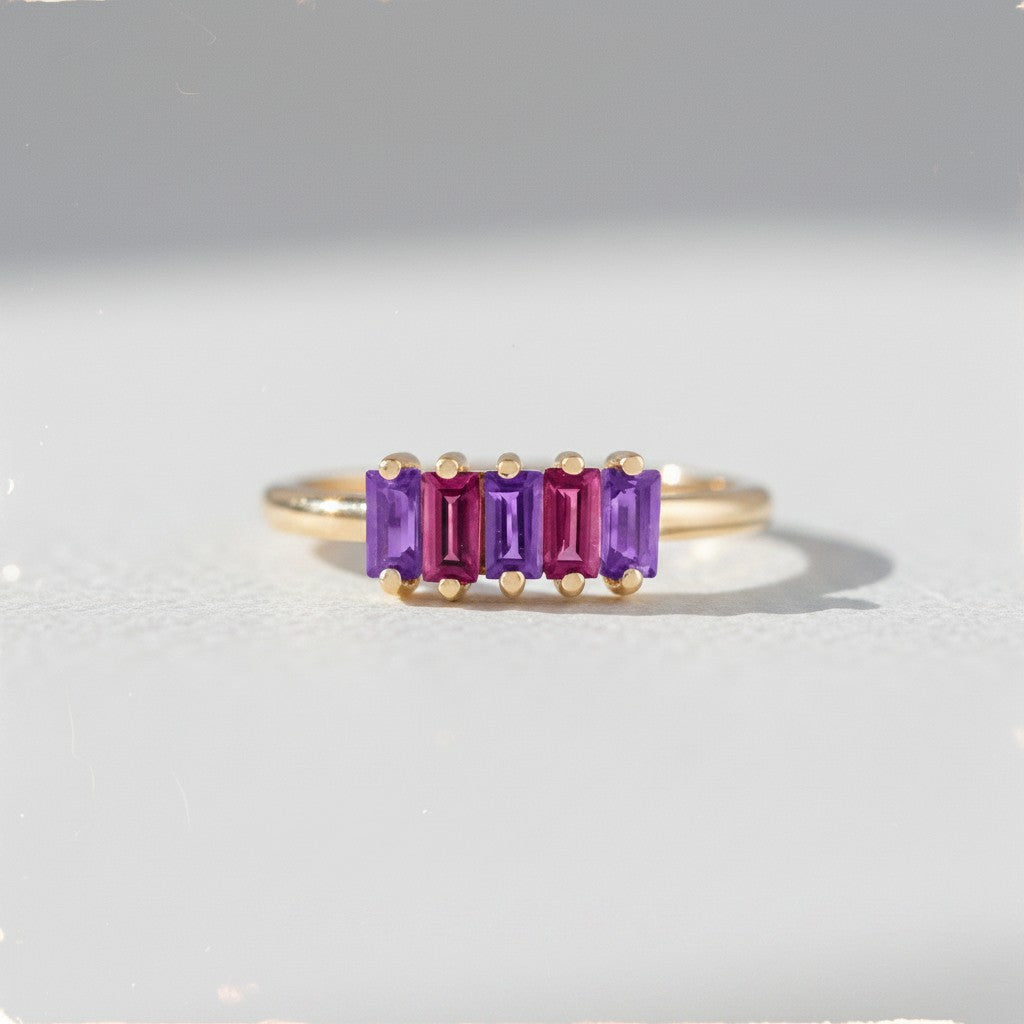 Sophia Schneider Joyas 14K gold ring with five baguette-cut amethyst and rhodolite stones in alternating purple and pink hues.