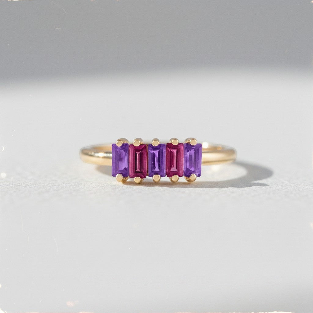 Sophia Schneider Joyas 14K gold ring with five baguette-cut amethyst and rhodolite stones in alternating purple and pink hues.