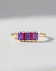 Sophia Schneider Joyas 14K gold ring with five baguette-cut amethyst and rhodolite stones in alternating purple and pink hues.
