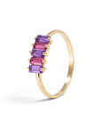 Sophia Schneider Joyas 14K gold ring with alternating amethyst and rhodolite baguette-cut stones.