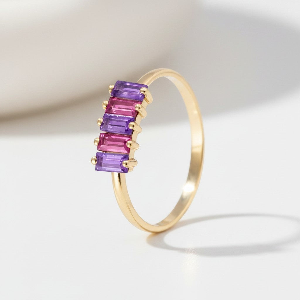 Sophia Schneider Joyas 14K gold ring with alternating purple amethyst and pink rhodolite baguette-cut stones.