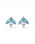 Sophia Schneider Joyas 14K gold earrings with marquise-cut blue topaz and white cz stones in a floral design.