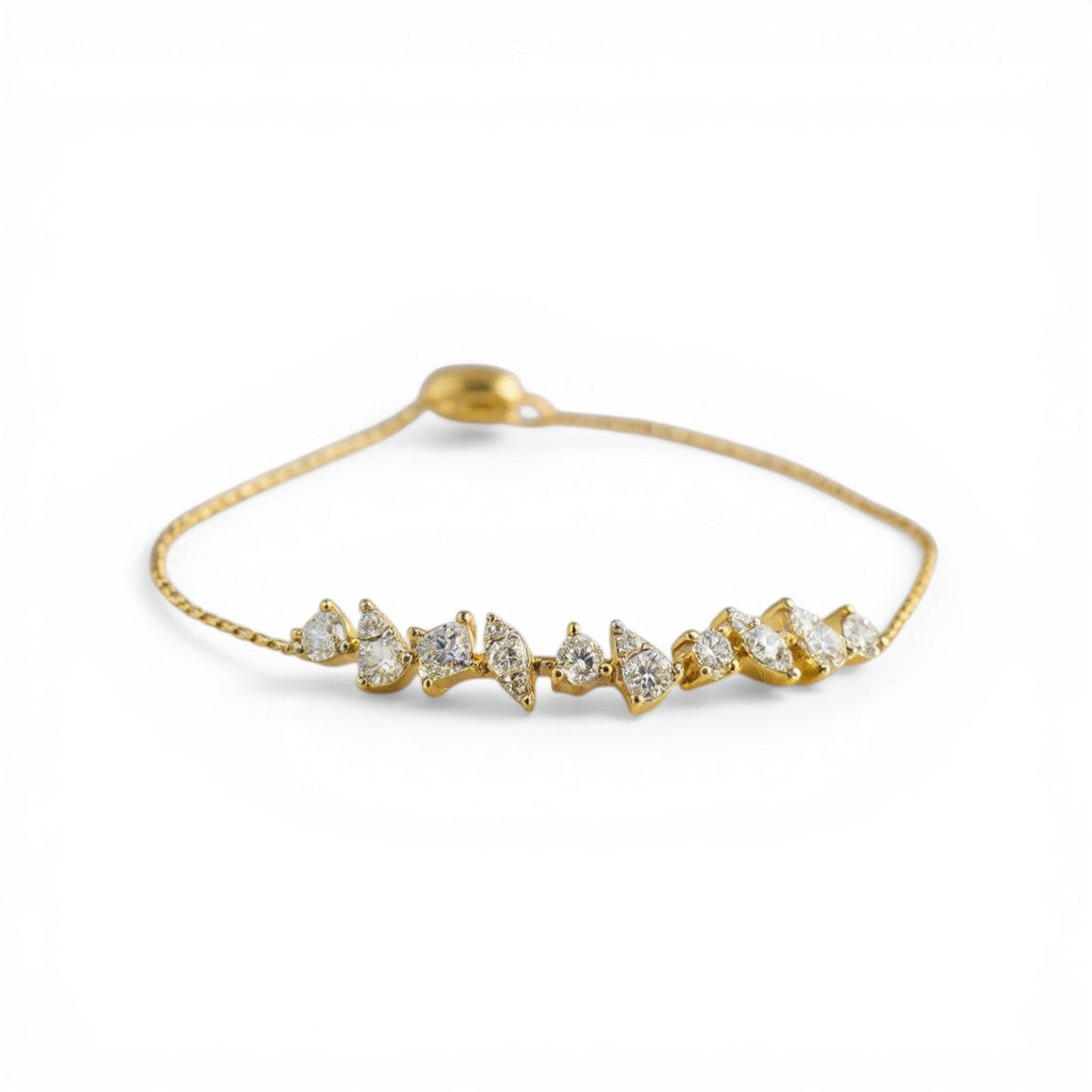 Sophia Schneider Joyas 14K gold bracelet with mixed-cut diamonds in various shapes and sizes, adjustable length.