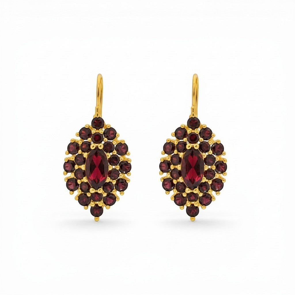 Sophia Schneider Joyas 14K gold dangle earrings featuring a marquise-cut garnet center surrounded by smaller garnets in a floral cluster design.