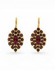 Sophia Schneider Joyas 14K gold dangle earrings featuring a marquise-cut garnet center surrounded by smaller garnets in a floral cluster design.