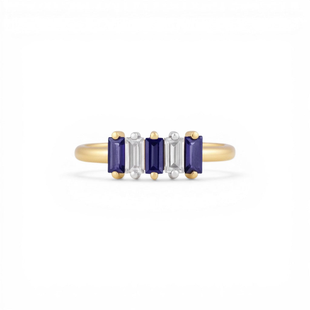 Sophia Schneider Joyas 14K gold ring with alternating Iolita and zircon baguette-cut stones.