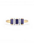 Sophia Schneider Joyas 14K gold ring with alternating Iolita and zircon baguette-cut stones.