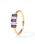 Sophia Schneider Joyas 14K gold ring with alternating purple iolite and clear zircon baguette stones.