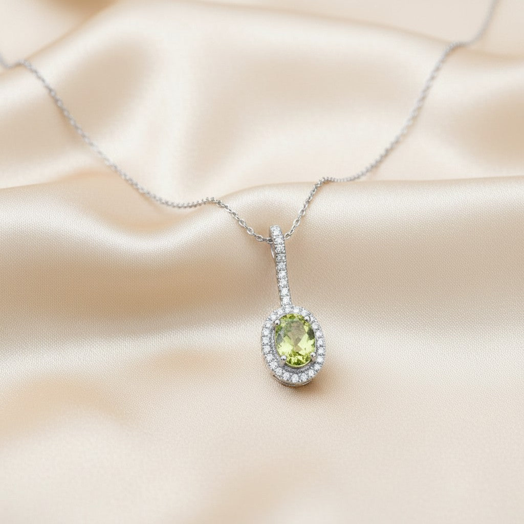 Sophia Schneider Joyas 14K white gold pendant necklace with oval peridot and diamond halo