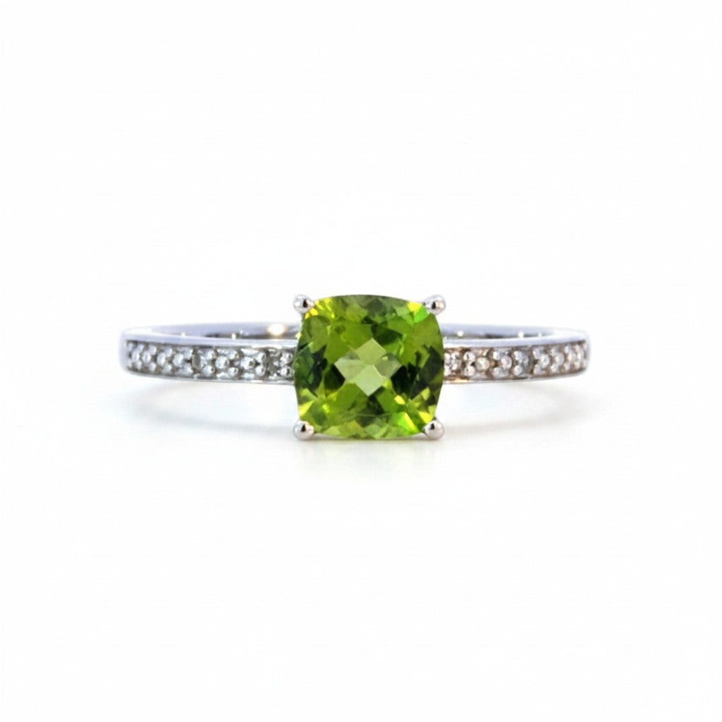 Sophia Schneider Joyas 14K gold ring with cushion-cut peridot and 0.62 ct diamonds on band.