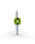 Sophia Schneider Joyas 14K gold ring with cushion-cut peridot and 0.62 ct diamonds on band.