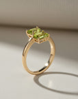 Sophia Schneider Joyas 14K gold ring with two marquise-cut peridot gemstones.