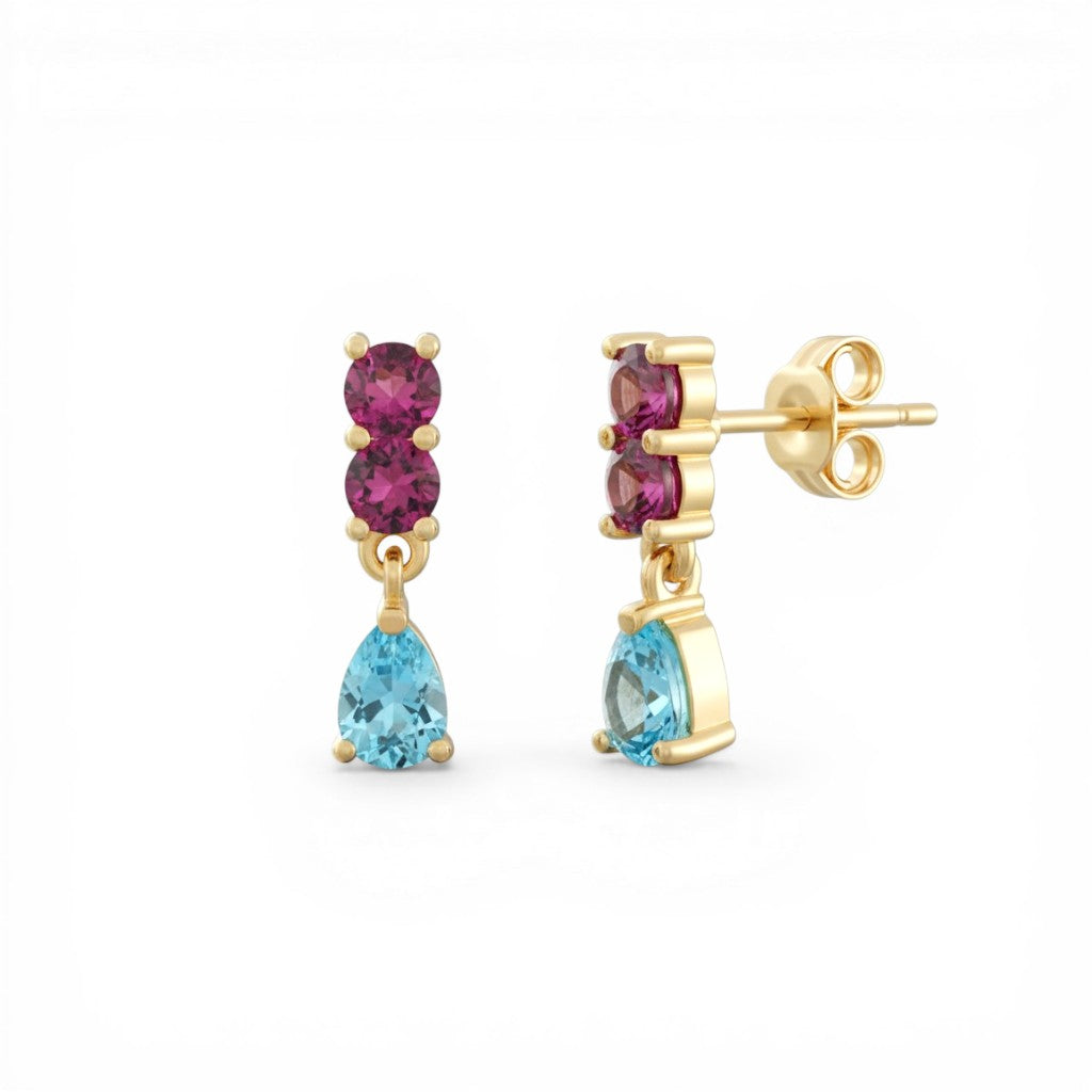 Sophia Schneider Joyas 14K gold drop earrings with two pink rhodolite stones and a pear-cut blue topaz.