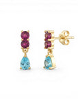 Sophia Schneider Joyas 14K gold drop earrings with two pink rhodolite stones and a pear-cut blue topaz.