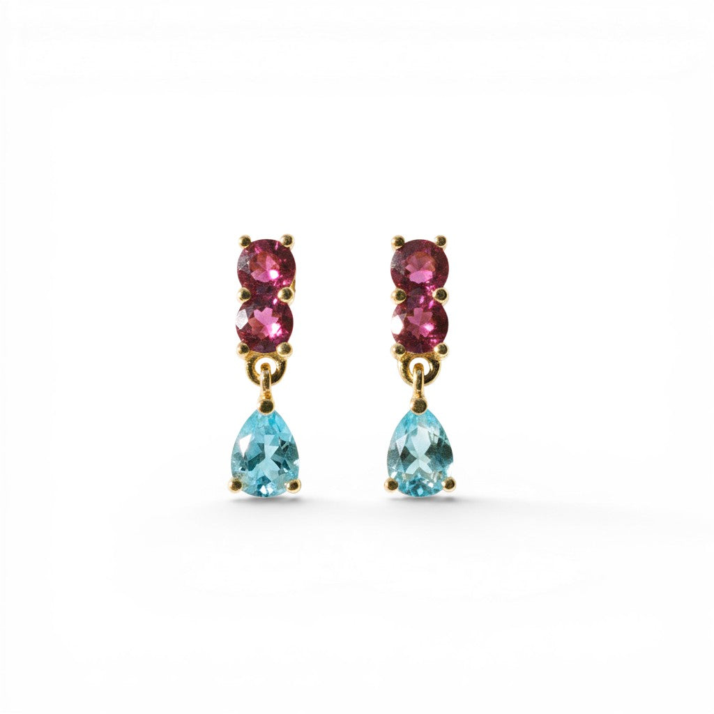 Sophia Schneider Joyas 14K gold drop earrings with two pink rhodolite stones and a pear-cut blue topaz.