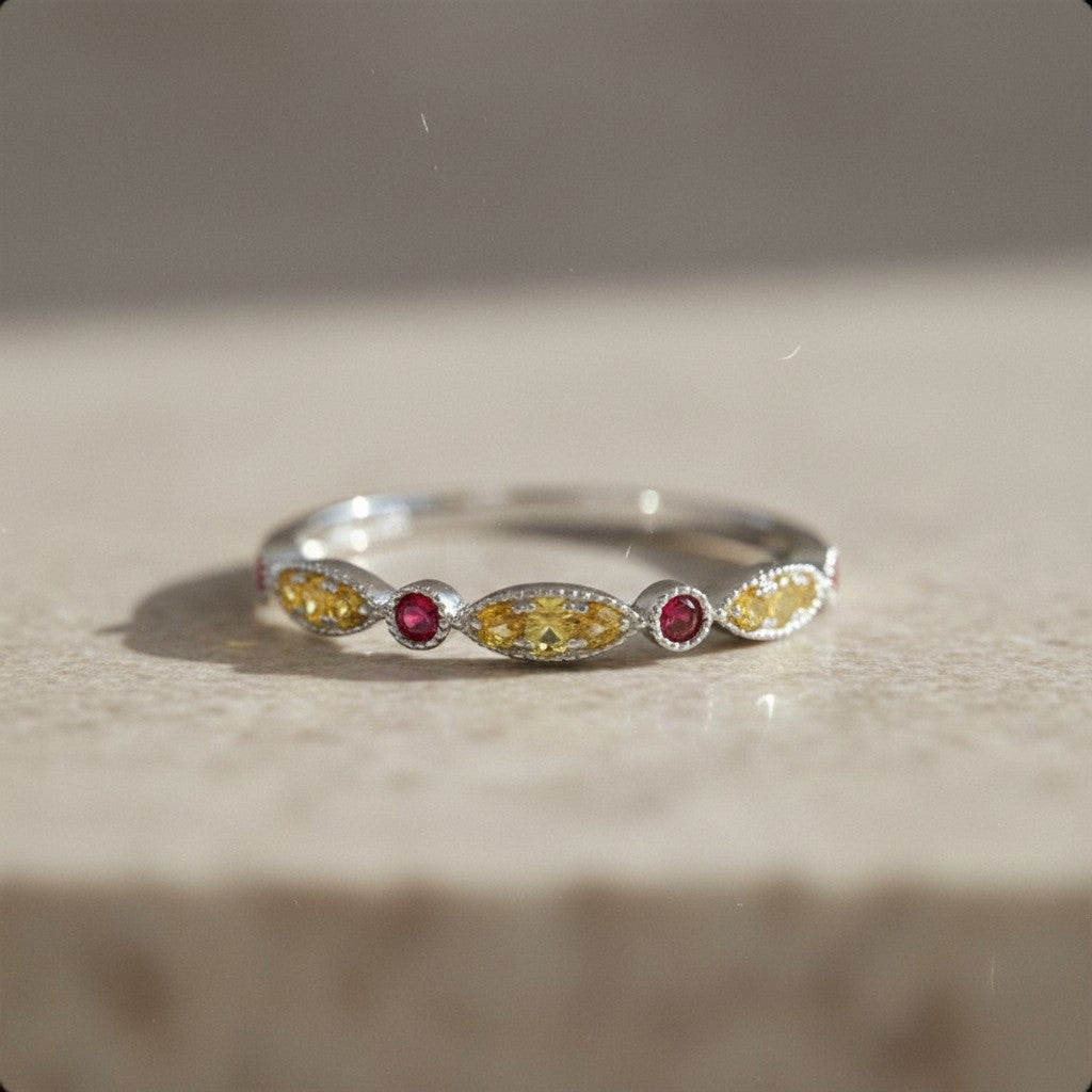 Sophia Schneider Joyas 14K gold ring with alternating marquise-cut yellow sapphires and round rubies.