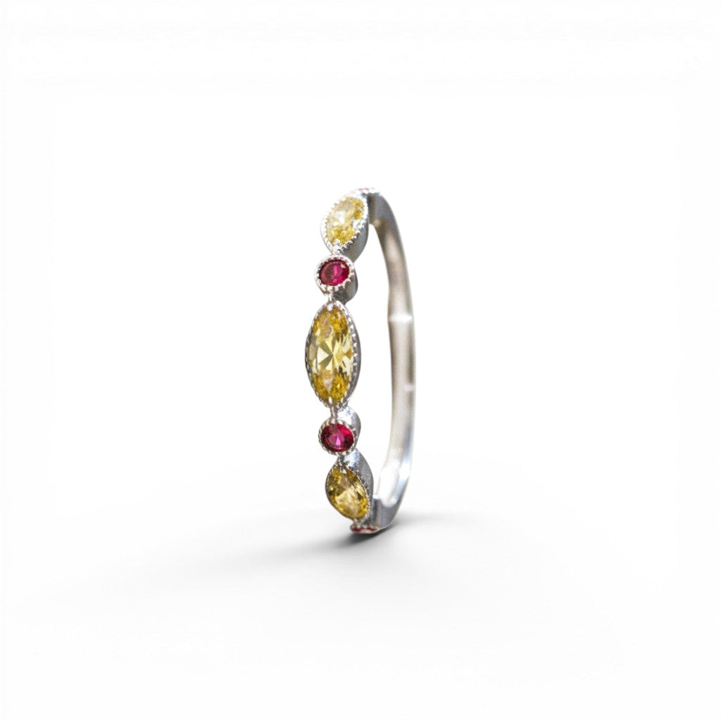 Sophia Schneider Joyas 14K gold ring with alternating yellow sapphires and red rubies, 0.24 ct total.