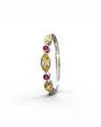 Sophia Schneider Joyas 14K gold ring with alternating yellow sapphires and red rubies, 0.24 ct total.