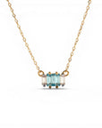 Sophia Schneider Joyas 14K gold necklace with a central row of baguette-cut blue topaz stones flanked by clear cubic zirconia.