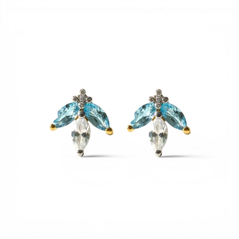 Sophia Schneider Joyas 14K gold earrings with marquise-cut blue topaz, clear cz, and diamonds. Elegant floral design.