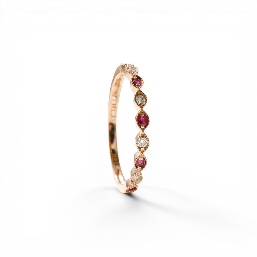 Sophia Schneider Joyas 14K rose gold ring with alternating marquise-cut rubies and round diamonds.